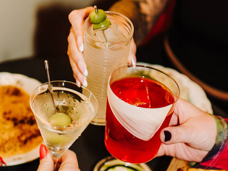 Friends toasting with bespoke cocktails